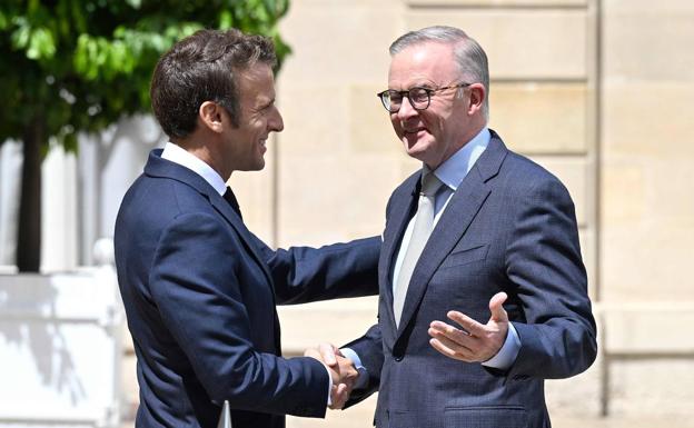 French President Emmanuel Macron and Australian Prime Minister Anthony Albanese shake hands in Paris on Friday.