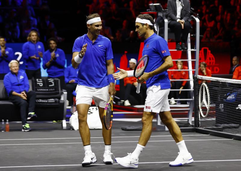 Rafa Nadal celebrates a Laver Cup doubles match action with Roger Federer